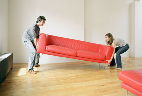 Couple Moves Red Couch into Home